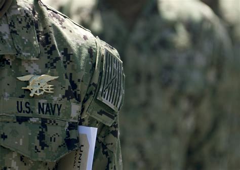 navy seal trident on uniform.